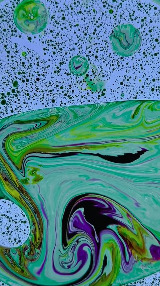 Colorful liquid patterns swirling in mesmerizing abstract designs.